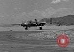 Image of Repair of U.S. C-46 aircraft with help of indigenous people Burma, 1944, second 5 stock footage video 65675052233