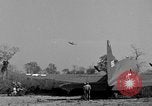 Image of Repair of U.S. C-46 aircraft with help of indigenous people Burma, 1944, second 39 stock footage video 65675052233