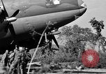 Image of Repair of U.S. C-46 aircraft with help of indigenous people Burma, 1944, second 49 stock footage video 65675052233