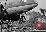Image of Repair of U.S. C-46 aircraft with help of indigenous people Burma, 1944, second 50 stock footage video 65675052233