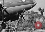 Image of Repair of U.S. C-46 aircraft with help of indigenous people Burma, 1944, second 51 stock footage video 65675052233