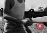 Image of Repair of U.S. C-46 aircraft with help of indigenous people Burma, 1944, second 55 stock footage video 65675052233