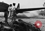 Image of Repair of U.S. C-46 aircraft with help of indigenous people Burma, 1944, second 57 stock footage video 65675052233