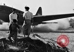 Image of Repair of U.S. C-46 aircraft with help of indigenous people Burma, 1944, second 58 stock footage video 65675052233