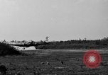 Image of Repair of U.S. C-46 aircraft with help of indigenous people Burma, 1944, second 62 stock footage video 65675052233