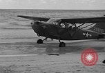 Standbild US Army Piloten fliegen Stinson L-5 Sentinal Flugzeug Palawan Philippinen, 1945, aus Sekunde 28 historischem Filmmaterial Videoclip 65675052254
