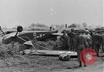 Image of Inverted US Army Stinson L-5 plane on field Italy, 1944, second 20 stock footage video 65675052268