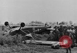 Image of Inverted US Army Stinson L-5 plane on field Italy, 1944, second 21 stock footage video 65675052268