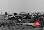 Image of Inverted US Army Stinson L-5 plane on field Italy, 1944, second 22 stock footage video 65675052268