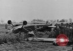 Image of Inverted US Army Stinson L-5 plane on field Italy, 1944, second 24 stock footage video 65675052268