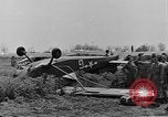 Image of Inverted US Army Stinson L-5 plane on field Italy, 1944, second 25 stock footage video 65675052268