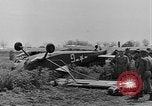 Image of Inverted US Army Stinson L-5 plane on field Italy, 1944, second 26 stock footage video 65675052268