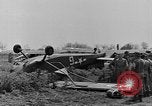 Image of Inverted US Army Stinson L-5 plane on field Italy, 1944, second 27 stock footage video 65675052268