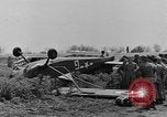 Image of Inverted US Army Stinson L-5 plane on field Italy, 1944, second 28 stock footage video 65675052268