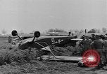 Image of Inverted US Army Stinson L-5 plane on field Italy, 1944, second 29 stock footage video 65675052268
