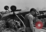 Image of Inverted US Army Stinson L-5 plane on field Italy, 1944, second 31 stock footage video 65675052268