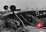 Image of Inverted US Army Stinson L-5 plane on field Italy, 1944, second 32 stock footage video 65675052268