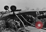 Image of Inverted US Army Stinson L-5 plane on field Italy, 1944, second 33 stock footage video 65675052268
