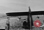 Image of Inverted US Army Stinson L-5 plane on field Italy, 1944, second 37 stock footage video 65675052268