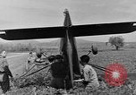 Image of Inverted US Army Stinson L-5 plane on field Italy, 1944, second 38 stock footage video 65675052268