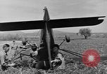 Image of Inverted US Army Stinson L-5 plane on field Italy, 1944, second 39 stock footage video 65675052268