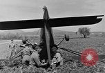 Image of Inverted US Army Stinson L-5 plane on field Italy, 1944, second 40 stock footage video 65675052268
