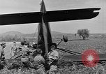 Image of Inverted US Army Stinson L-5 plane on field Italy, 1944, second 41 stock footage video 65675052268