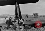 Image of Inverted US Army Stinson L-5 plane on field Italy, 1944, second 42 stock footage video 65675052268