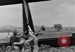 Image of Inverted US Army Stinson L-5 plane on field Italy, 1944, second 43 stock footage video 65675052268