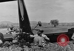 Image of Inverted US Army Stinson L-5 plane on field Italy, 1944, second 45 stock footage video 65675052268