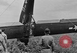 Image of Inverted US Army Stinson L-5 plane on field Italy, 1944, second 47 stock footage video 65675052268