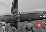 Image of Inverted US Army Stinson L-5 plane on field Italy, 1944, second 50 stock footage video 65675052268