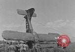 Image of Inverted US Army Stinson L-5 plane on field Italy, 1944, second 59 stock footage video 65675052268
