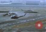 Image of UH-1B helicopter Saigon Vietnam, 1968, second 8 stock footage video 65675052341