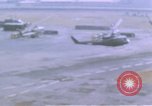 Image of UH-1B helicopter Saigon Vietnam, 1968, second 21 stock footage video 65675052341