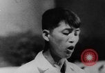 Image of Vietnam war protests North Vietnam, 1964, second 21 stock footage video 65675052360