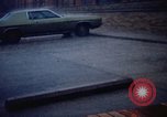 Standbild Wasser auf der Straße Rapid City South Dakota USA, 1972, aus Sekunde 60 historischem Filmmaterial Videoclip 65675052499