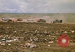 Image of trucks hauling debris Rapid City South Dakota USA, 1972, second 23 stock footage video 65675052516