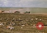 Image of trucks hauling debris Rapid City South Dakota USA, 1972, second 24 stock footage video 65675052516