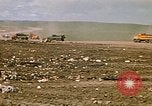 Image of trucks hauling debris Rapid City South Dakota USA, 1972, second 25 stock footage video 65675052516