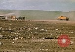 Image of trucks hauling debris Rapid City South Dakota USA, 1972, second 26 stock footage video 65675052516