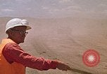 Image of trucks hauling debris Rapid City South Dakota USA, 1972, second 43 stock footage video 65675052516