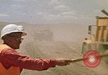 Image of trucks hauling debris Rapid City South Dakota USA, 1972, second 46 stock footage video 65675052516