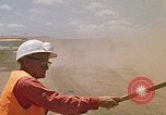 Image of trucks hauling debris Rapid City South Dakota USA, 1972, second 50 stock footage video 65675052516