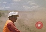 Image of trucks hauling debris Rapid City South Dakota USA, 1972, second 52 stock footage video 65675052516