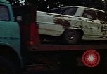 Image of trucks hauling wrecked cars Rapid City South Dakota USA, 1972, second 47 stock footage video 65675052517