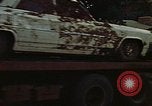 Image of trucks hauling wrecked cars Rapid City South Dakota USA, 1972, second 48 stock footage video 65675052517