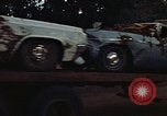 Image of trucks hauling wrecked cars Rapid City South Dakota USA, 1972, second 49 stock footage video 65675052517