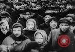 Image of massed crowd parading Moscow Russia Soviet Union, 1924, second 15 stock footage video 65675052607
