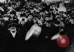 Image of massed crowd parading Moscow Russia Soviet Union, 1924, second 54 stock footage video 65675052607